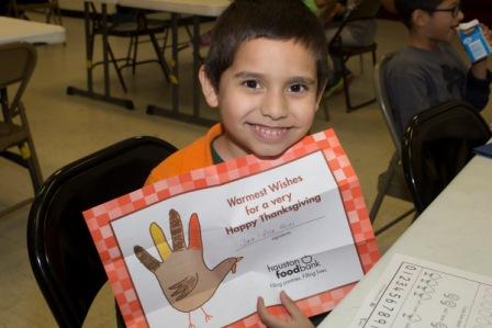 Boy Smiling with Placemat.jpg